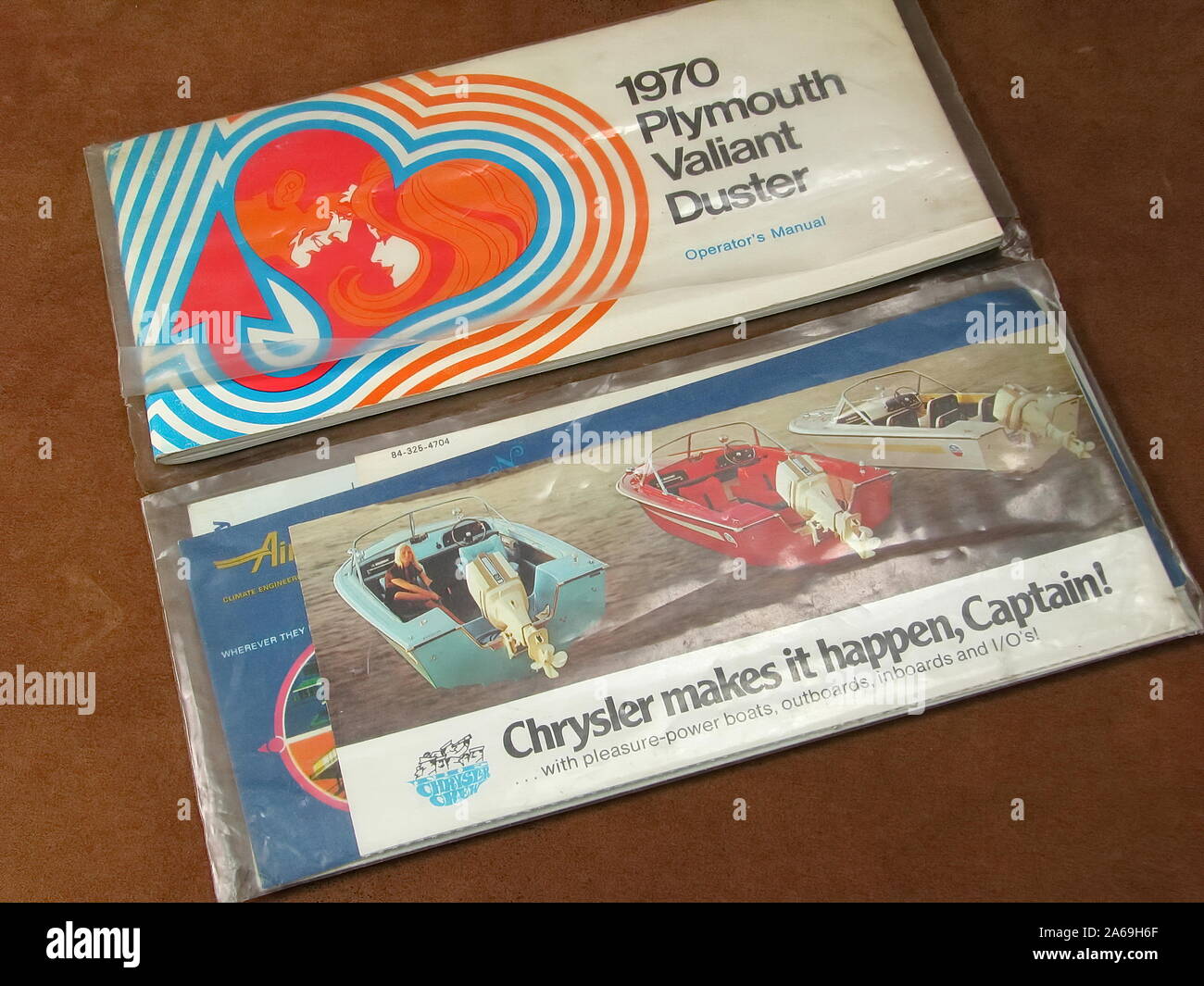 Vintage 1970 Plymouth Valiant Duster operator`s manual with Chrysler boating motors brochures. Stock Photo